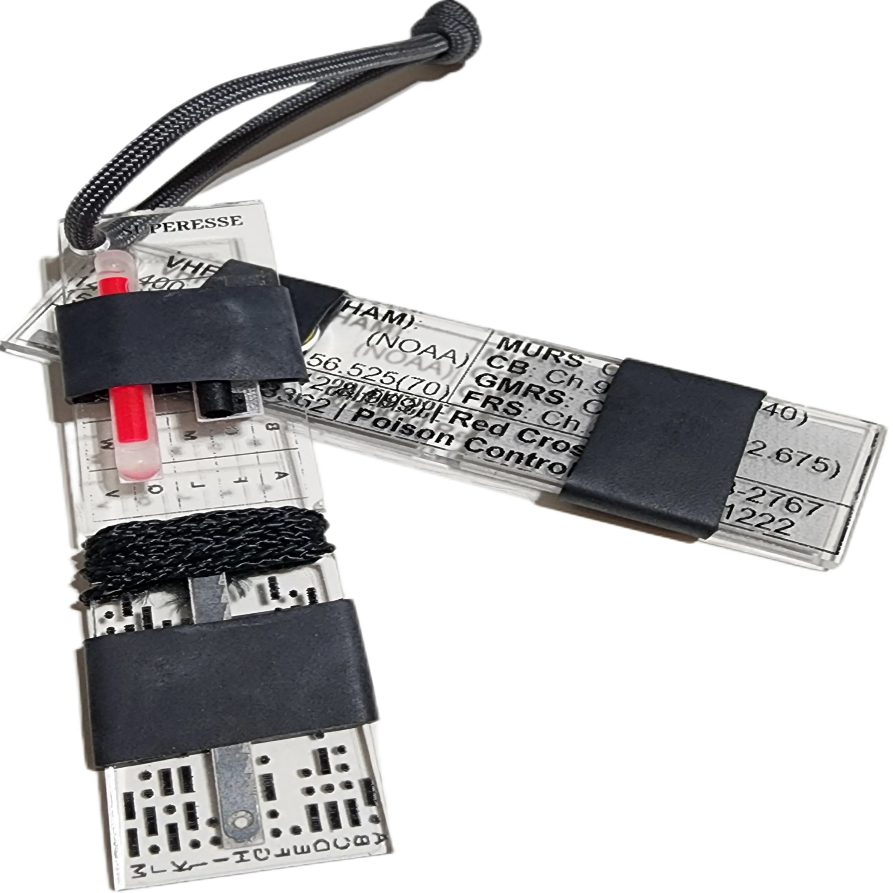 Partitioned Kit & Reference - Bar (PKR Bar): Keychain with compartmentalized storage areas for supplies and quick reference data engraved on backing.