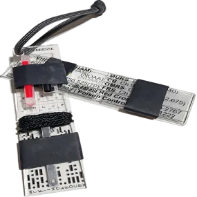 Partitioned Kit & Reference - Bar (PKR Bar): Keychain with compartmentalized storage areas for supplies and quick reference data engraved on backing.